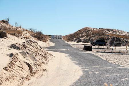 Be sure and keep your vehicle on the pavement.  If you drive in the sand you will get stuck.